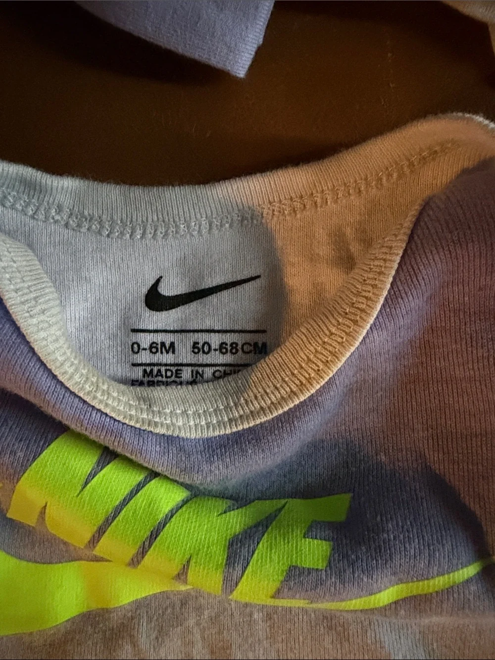 Nike Baby One-Piece Bodysuit in Light Purple with Neon Logo